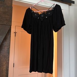 Black dress with floral appliqué